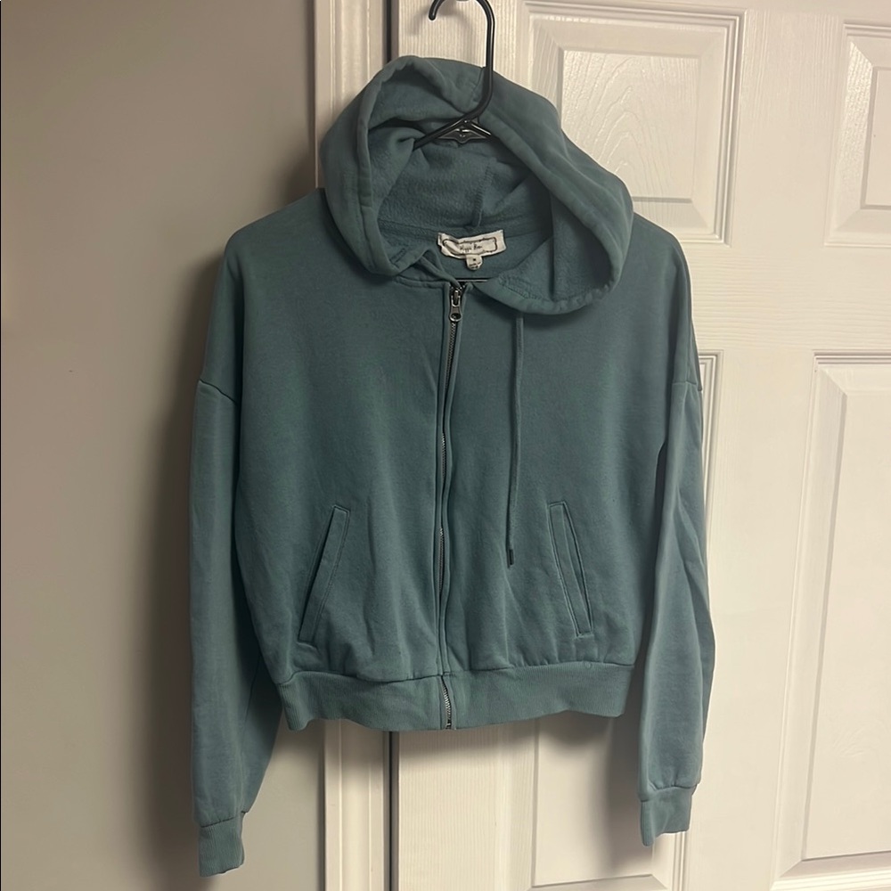 A. Teal Zip-Up Hoodie